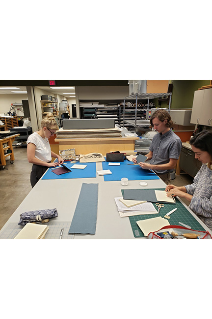 Students working in the UI Libraries Conservation Lab