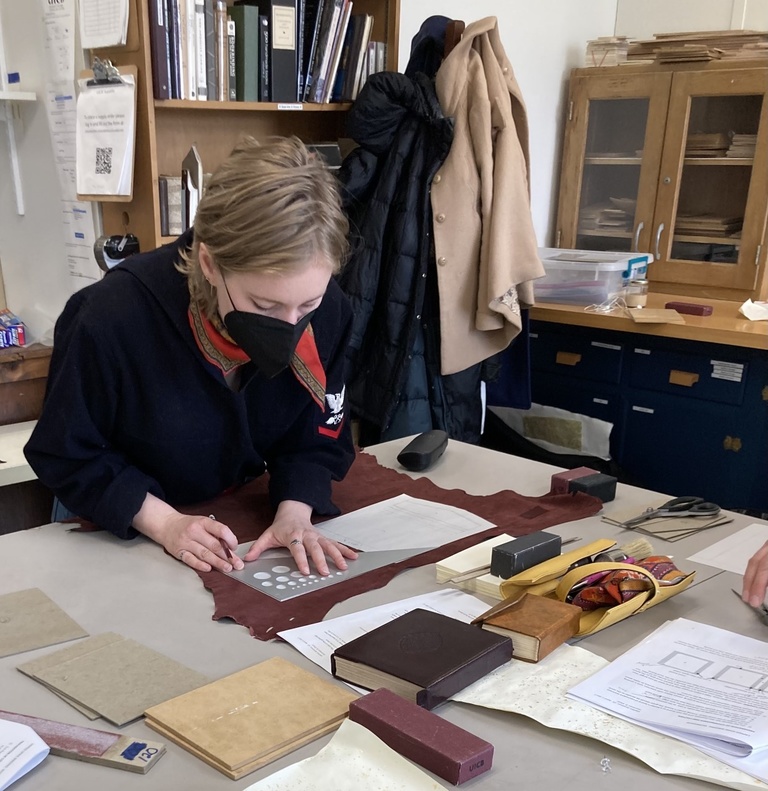 a workshop student working on creating an Islamic binding