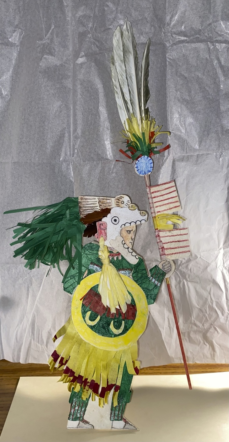 Green and Yellow costumed paper figure based on Aztec warrior figures in the Codex Mendoza