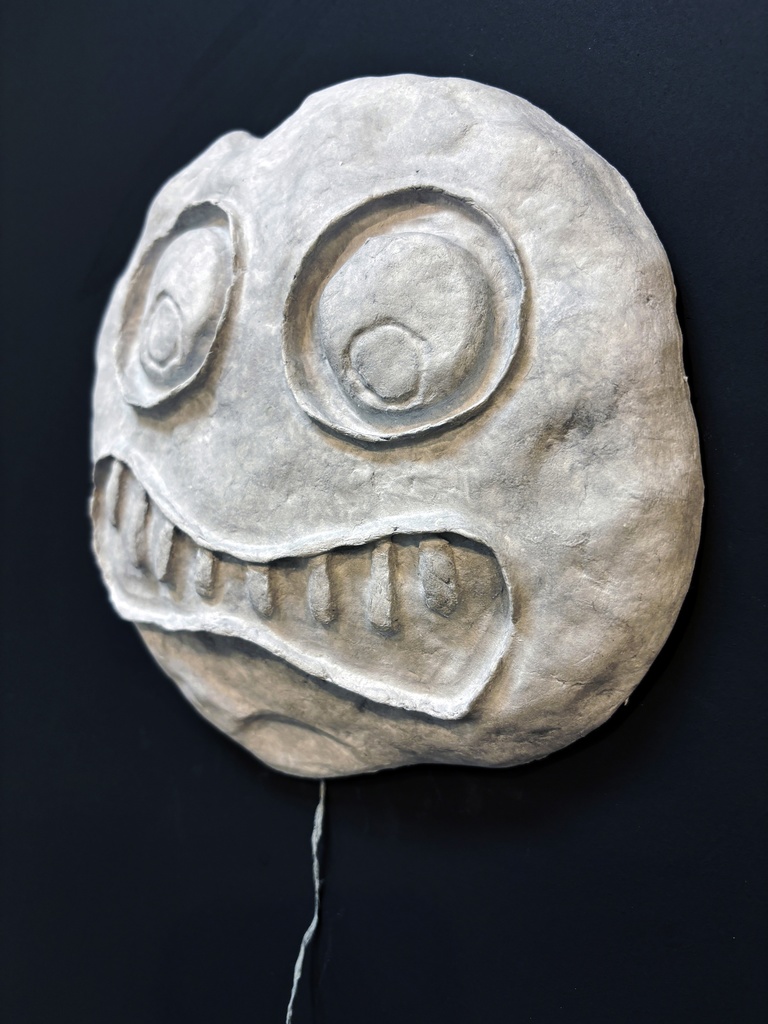 Scary face moulded out of paper