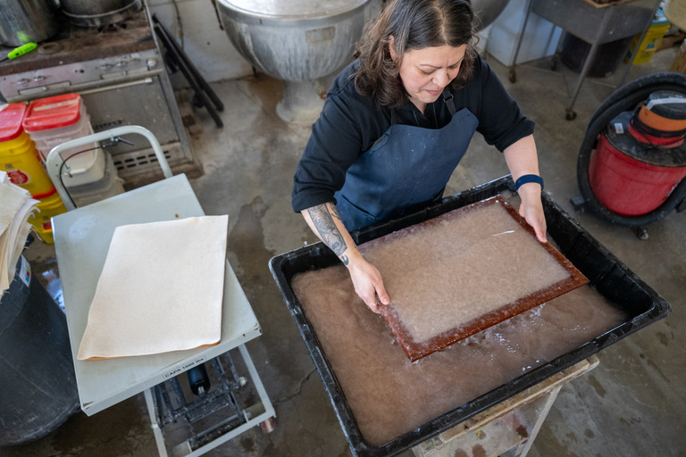 Woman making paper