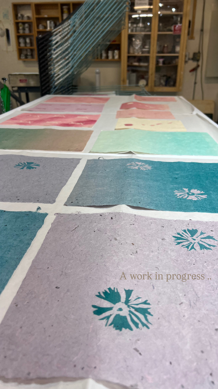 Monotype prints on table.
