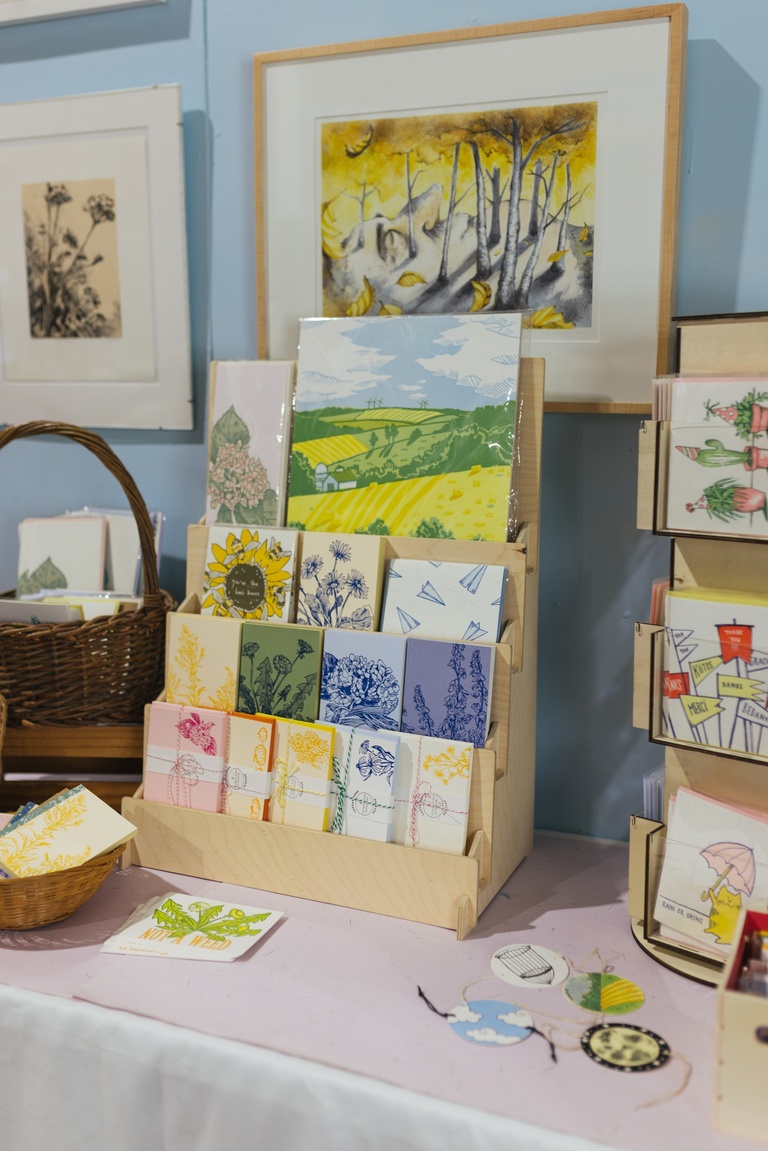 Market display with letterpress printed greeting cards and items.