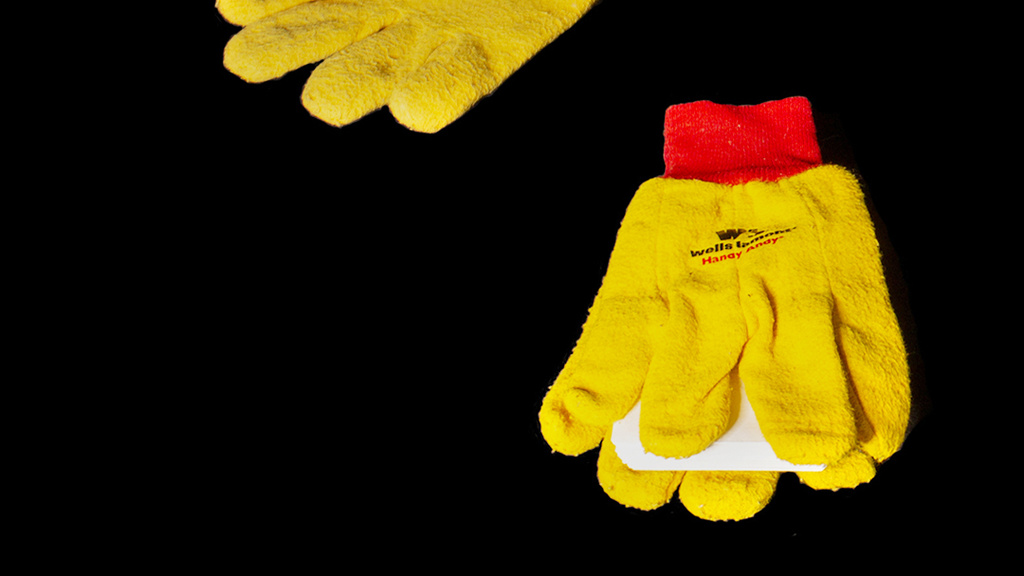 A book with gloves as cover